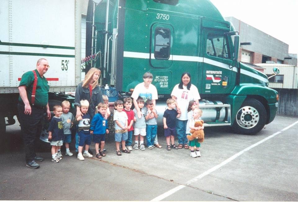 Kolton Bouse holding his bear with a blue nose (yes, he still has it) he is on the right, looking back to Grand Pa on the left (why is he with that kid?)