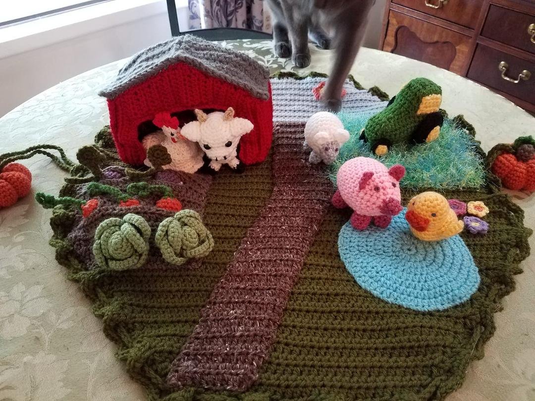 Farm playset. I've actually made quite a few of these over the years but have expanded on it over time. It is based on a Lion Brand pattern.