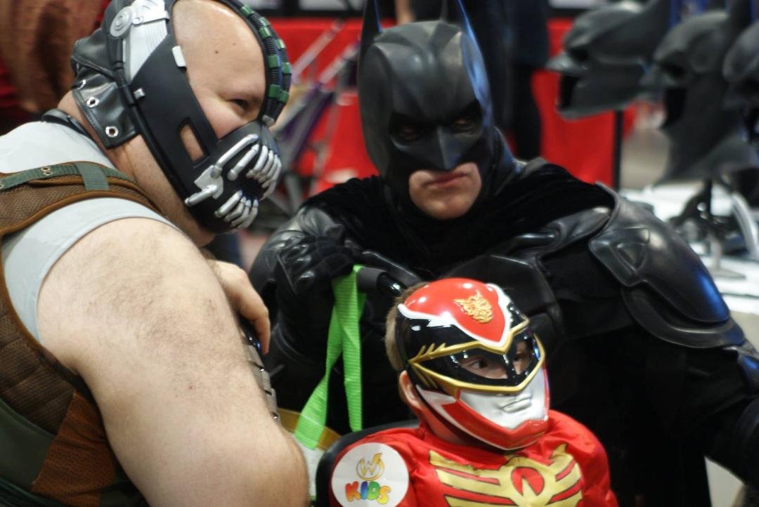 Little boy in wheelchair with his father on left at Nashville Comic Con Sunday