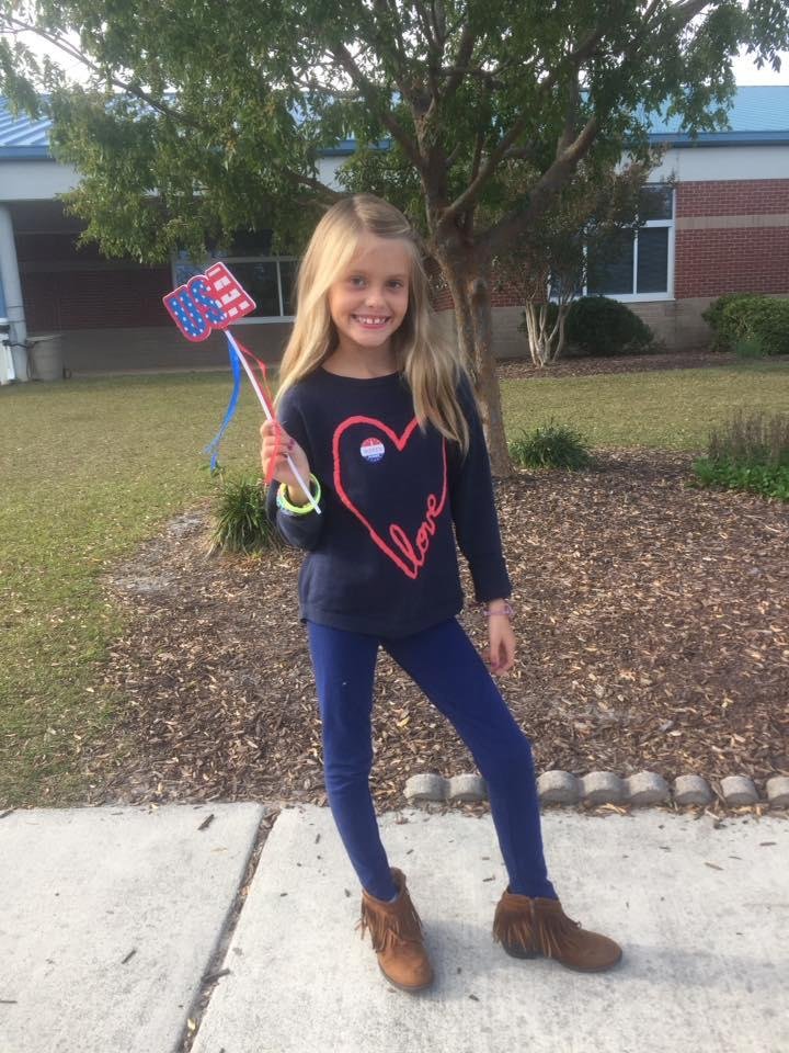 Our little Gabby voting today with her Mom.