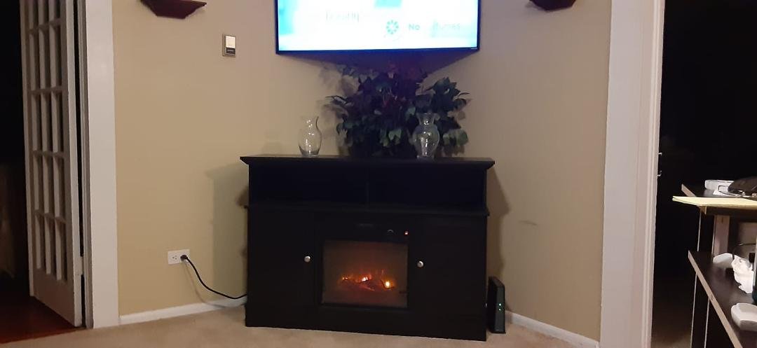 Aaron came by the other day and hung my TV over my fireplace and I love it it is exactly what I wanted thank you son I really do like it and I love you