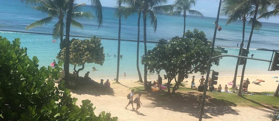 I'm having a real bucket list moment! Umbrella drinks at Waikiki beach after presenting really good training in Pearl Harbor!