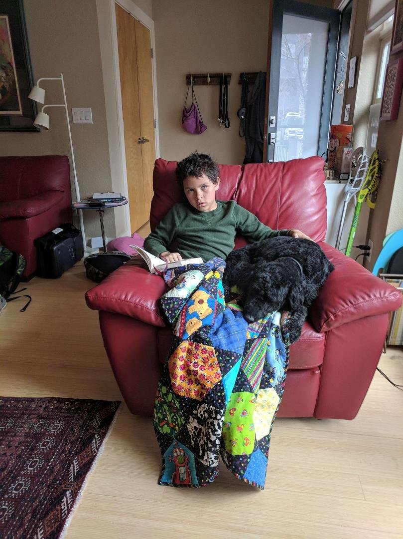 Malachi and Elle reading A Wrinkle in Time.