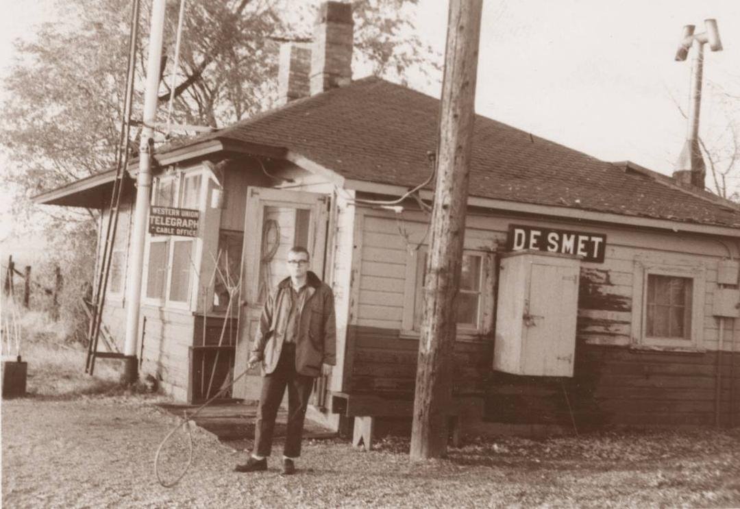 Another Throw Back Thursday! Yours truly posing at the DeSmet, Montana depot on the Northern Pacific in 1964, while working second trick (4 pm-midnite) as telegrapher. I was 19. Very proud of my white socks! I am holding a