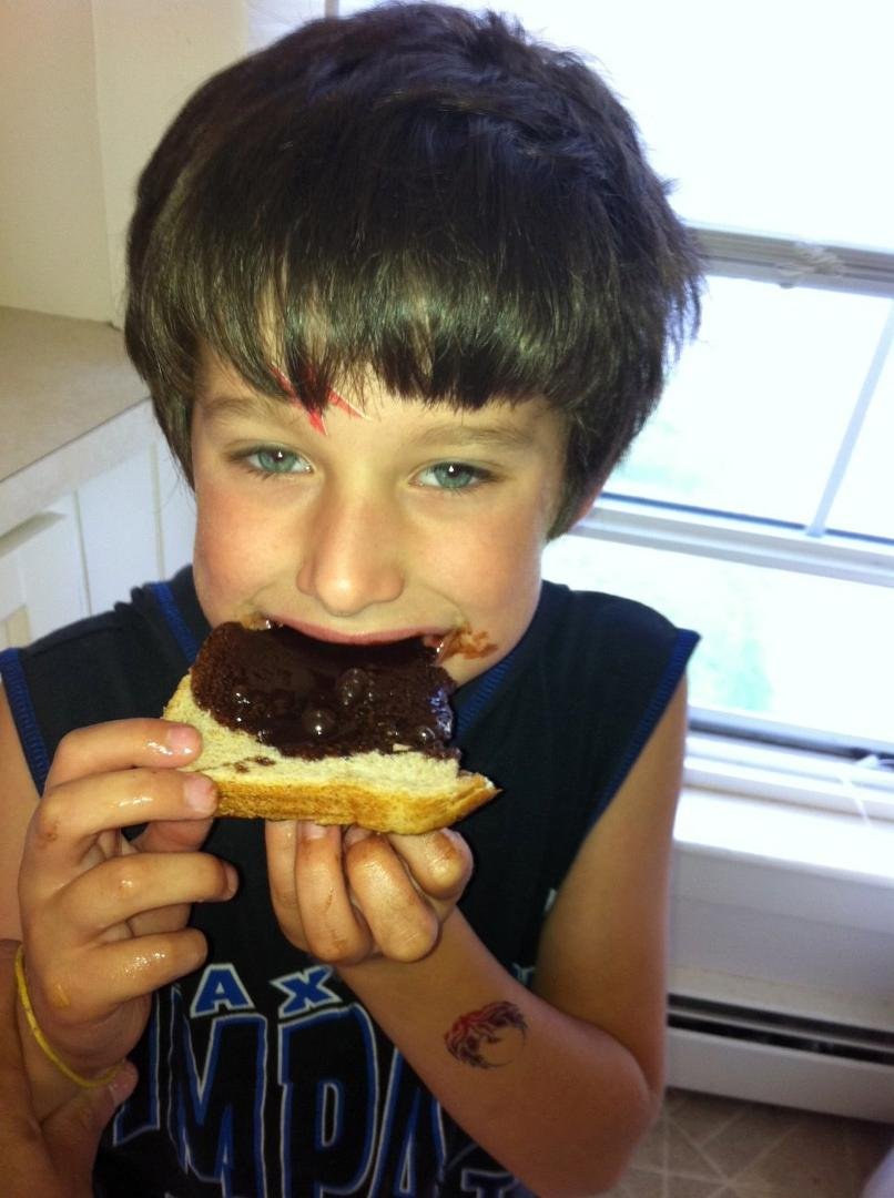 This is what happens when you leave a 6 year old in the kitchen by himself.....a chocolate syryp sandwich!!