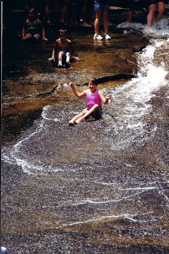 Granddaughter Kristina sliding down Sliding Rock