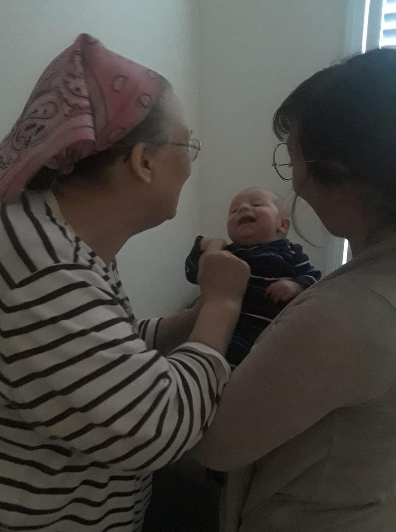 Toby and Grandma Losee meet for the first time.