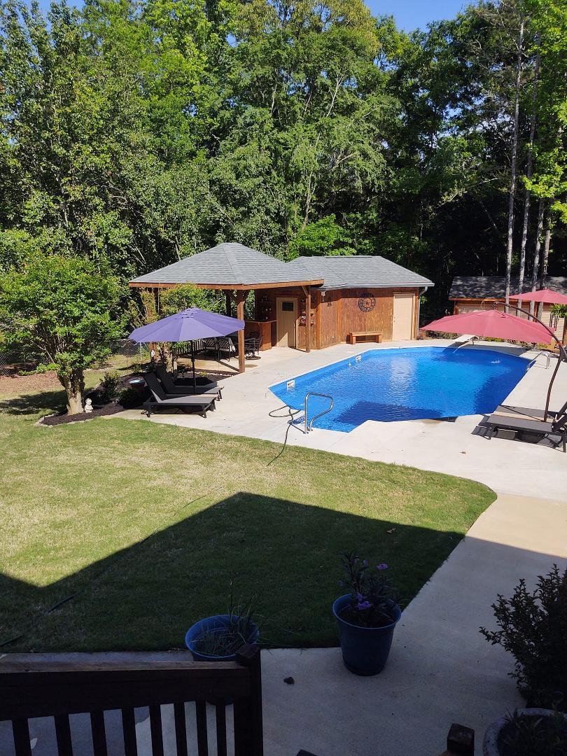Pool cleaned and flower bed done with new perennials and mulch - also cleaned and mulched the Bradford pear trees along the fence. Almost done!!