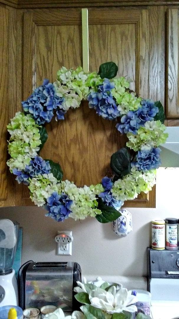 I saw a wreath like this at a store so I made one of my own! I'm still working on it..the leaves need to be arranged. I'm pleased!