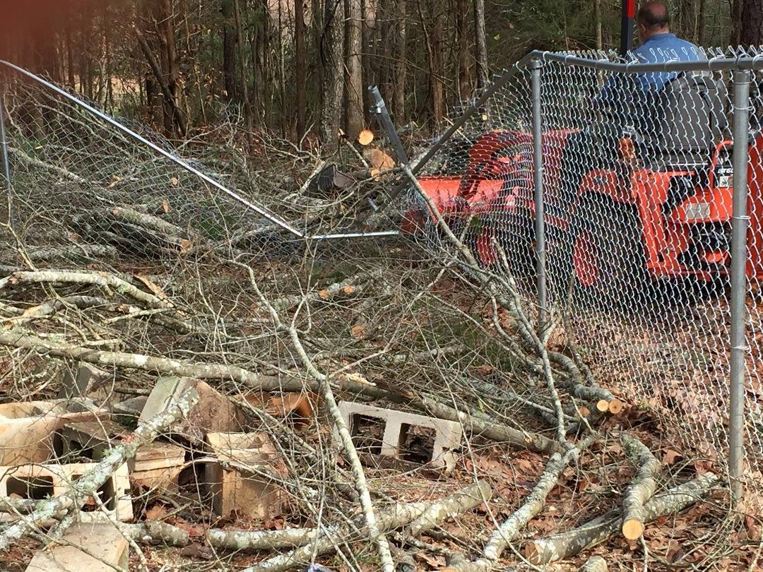 I got Randy a chain saw for Christmas. Oops, tree did not go where it should, now the dogs can get out. Man we needed that fence.