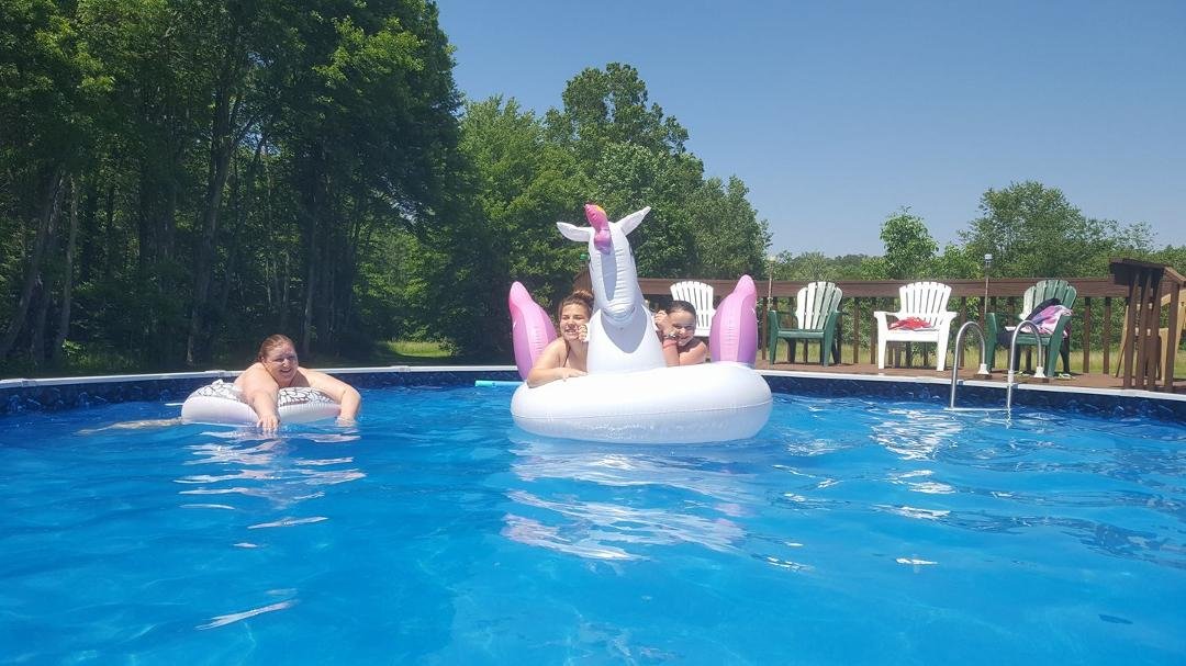Family in pool.