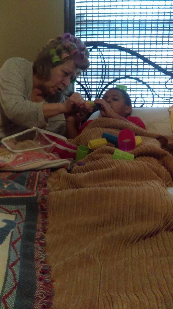 BRAXTON chillin with Nanna while she rolls her hair.