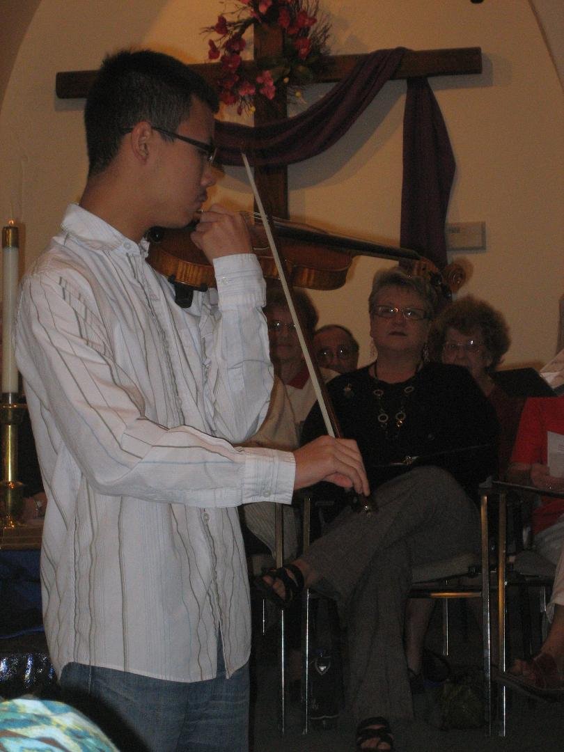 Albert Li playing violin at church, 12.12.2010