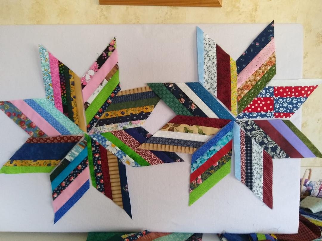 Starting a scrappy star quilt.