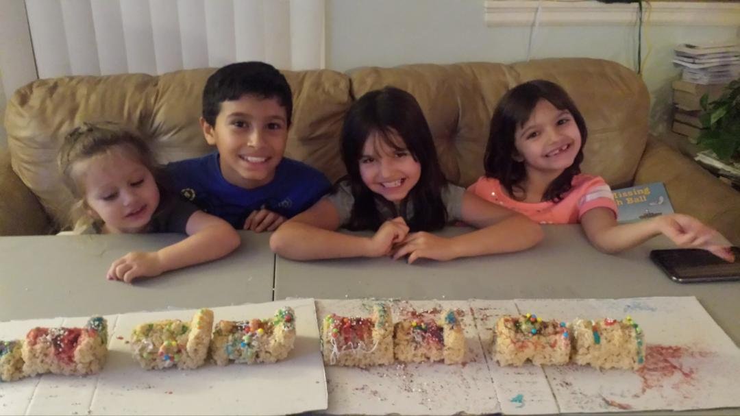 Kids making rice krispie treat train