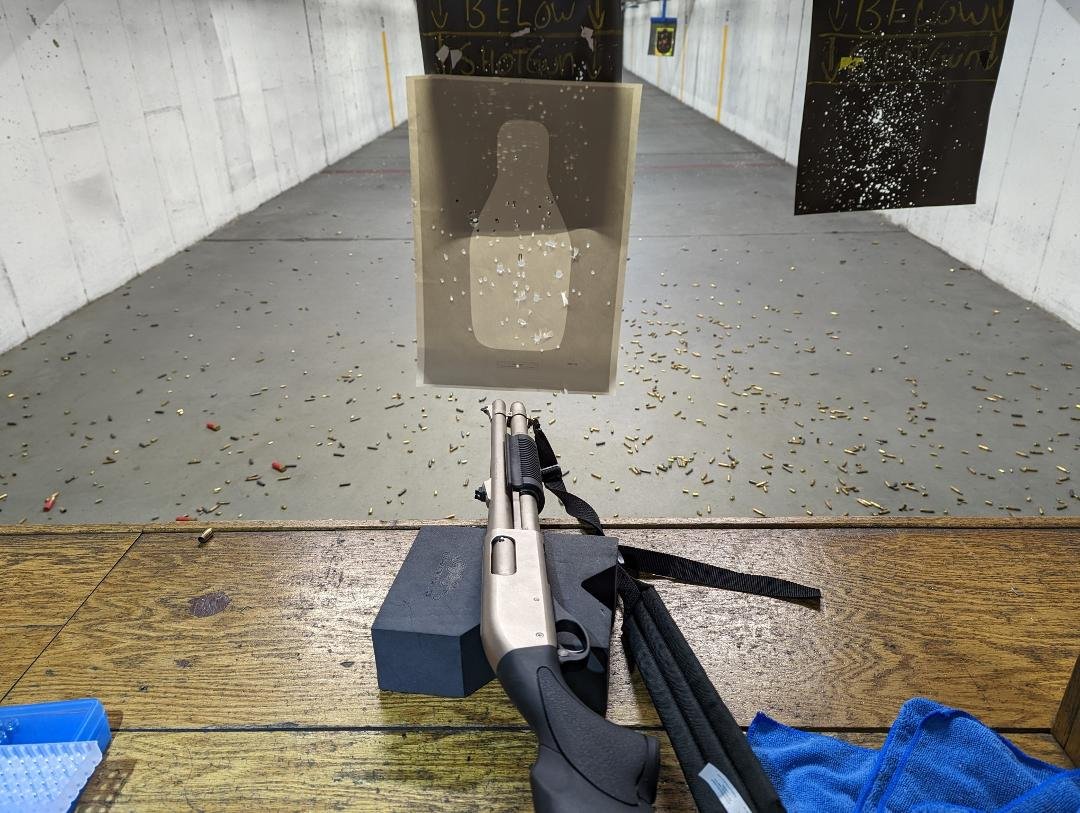 One very perforated FBI "bowling pin" target.