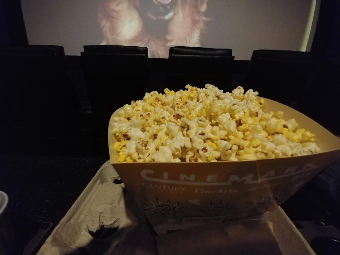 Movie day with my large extra butter popcorn and large coke