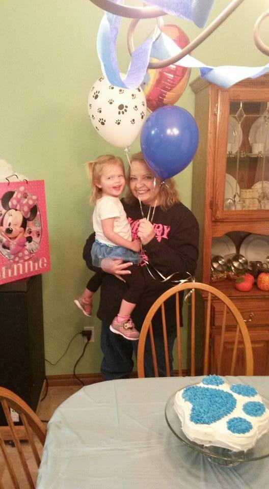 Happy second birthday to Isla with grandma at her party. Icing on the Blues Clues cake and the Oklahoma roads.
