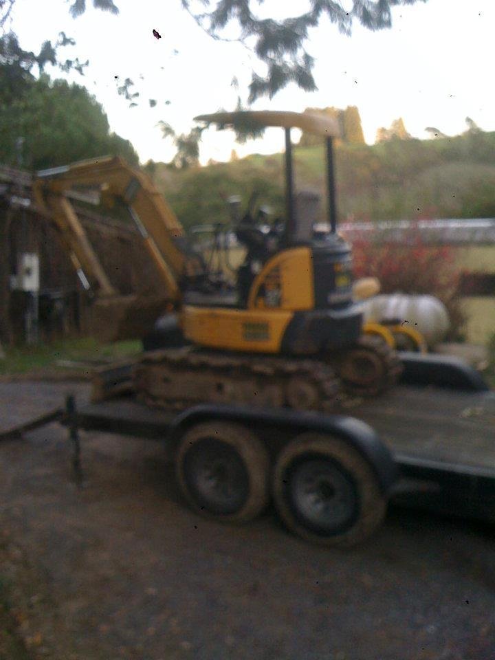 Rented excavator to prepare tank" hole" and place new tank