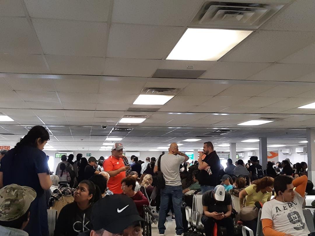 A sea of Mexicans and then single little old blue-eyed Canadian lady..waiting in the Monterrey airport.