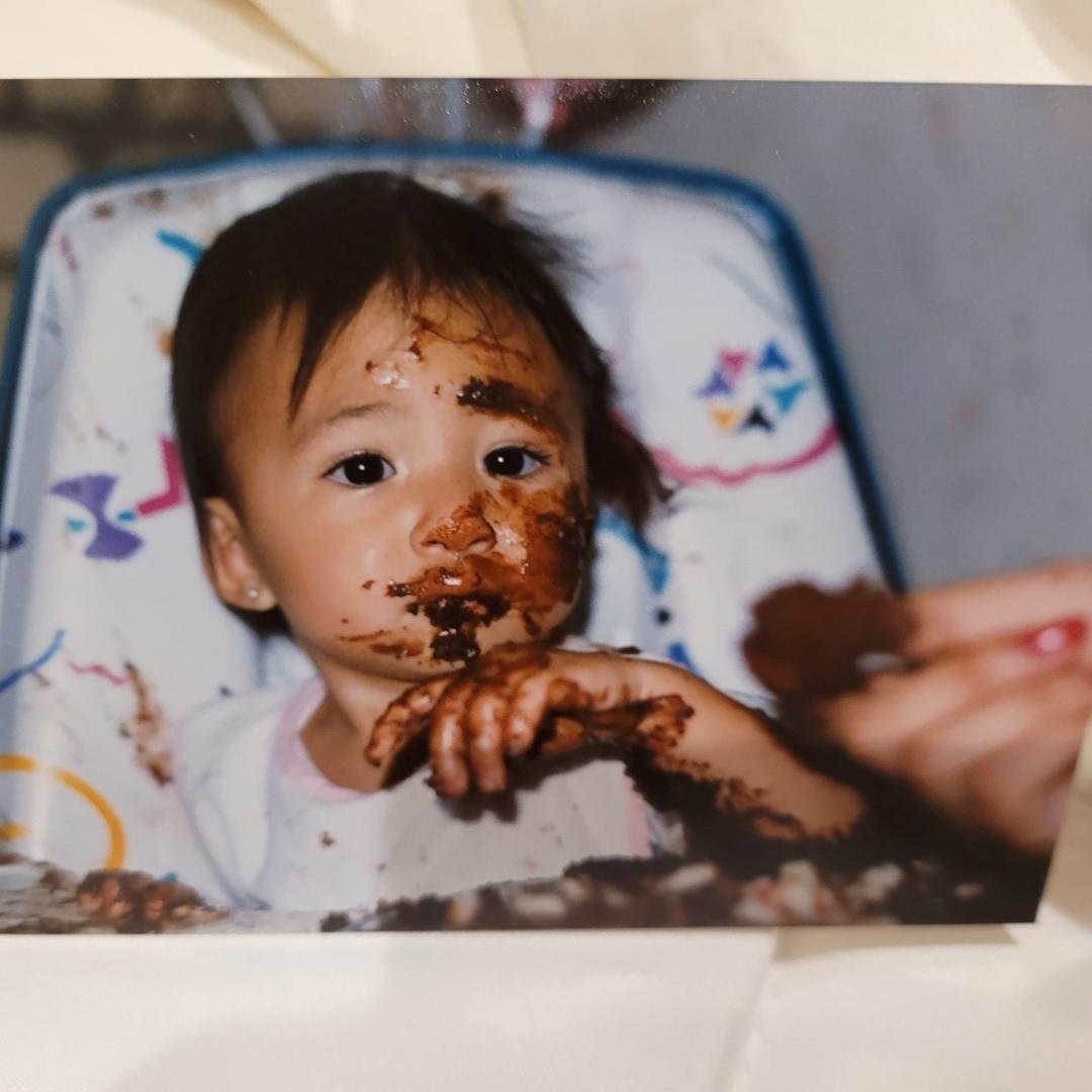 Daun Michelle Sikora enjoying her first birthday cake!