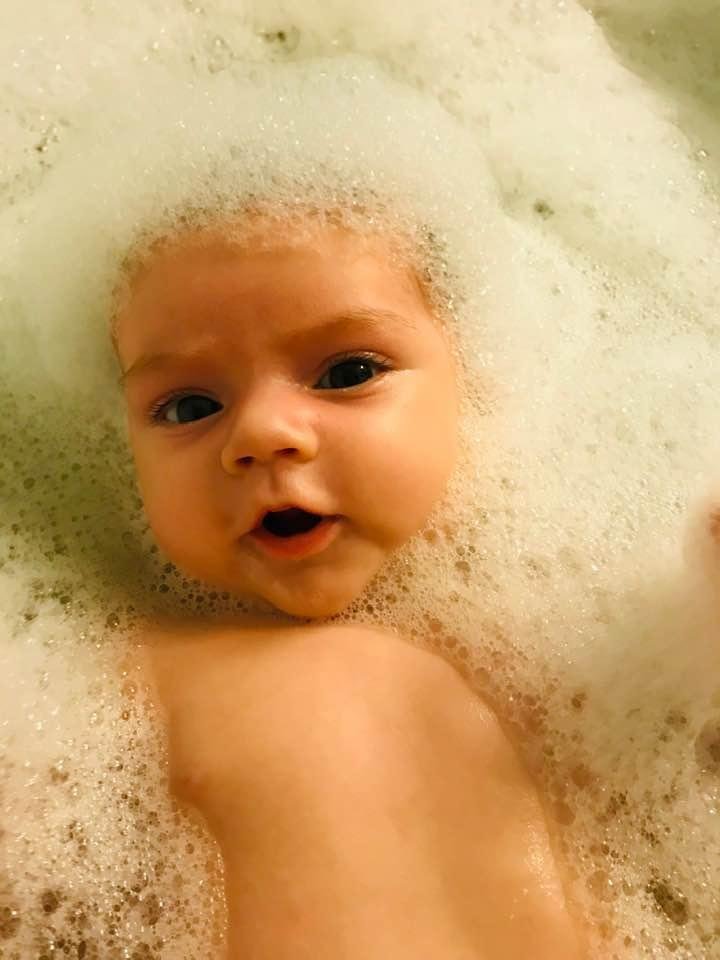Little cutie loves her bath!