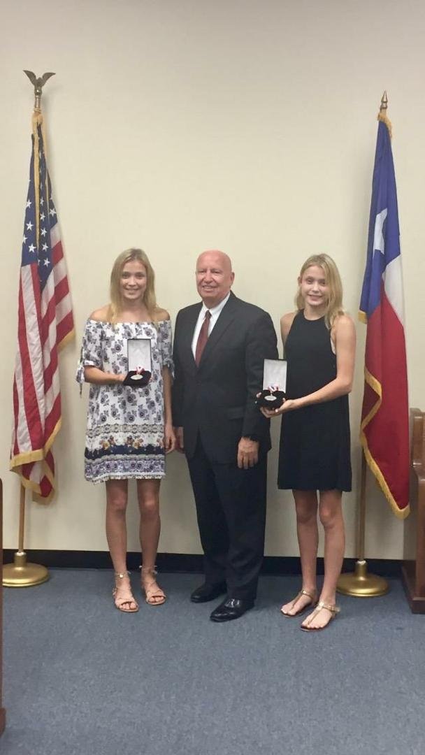 So proud...my granddaughters receiving their silver Congressional Medal from Representative Kevin Brady (Texas).