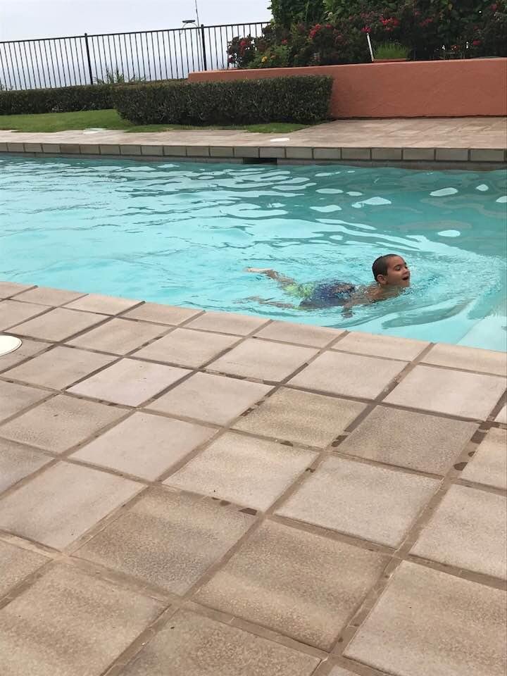 This is Connor swimming in our pool this morning.