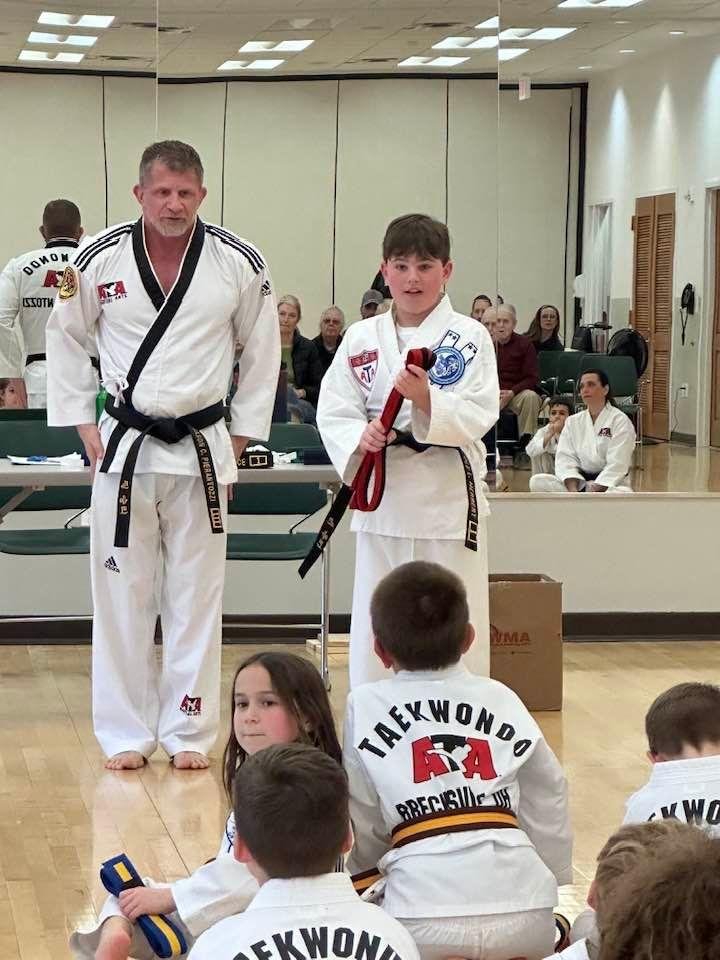 My grandson Cole became a black belt today. Proud of him. Tested out great and broke two wooden boards as part of the test.