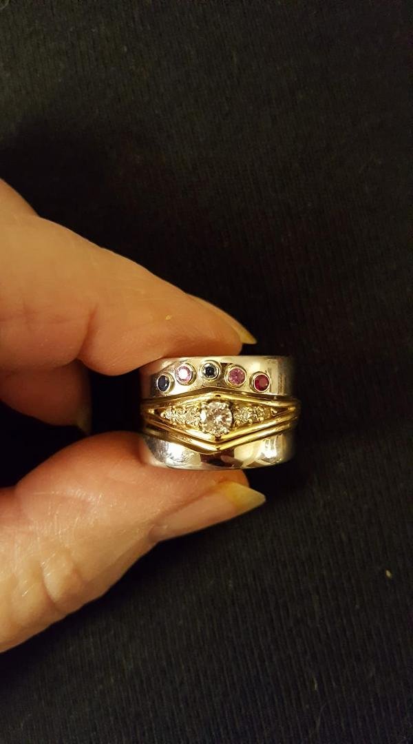 Finally took the time to get Daryl's and my wedding rings fit together and added all of our birthstones. Thanks to the designers at Ames Silversmithing.