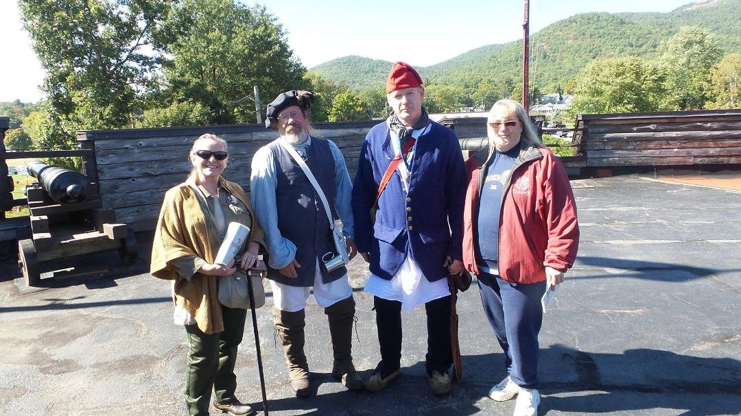 Lynn and Maggie with two of the soldiers for Fort W M Henry in Lake George , Ny 9/27/15