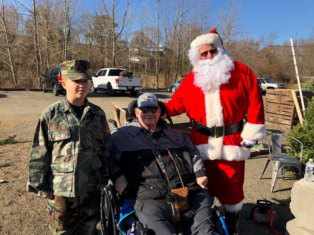 Uncle Kenny and Matt at The Gunpowder Christmas Tree Farm with Santa of course. WOW what a treat They have beautiful trees and a barn with goodies for sale. A make your own wreath stall, hot dogs and hot chocolate stall, ki