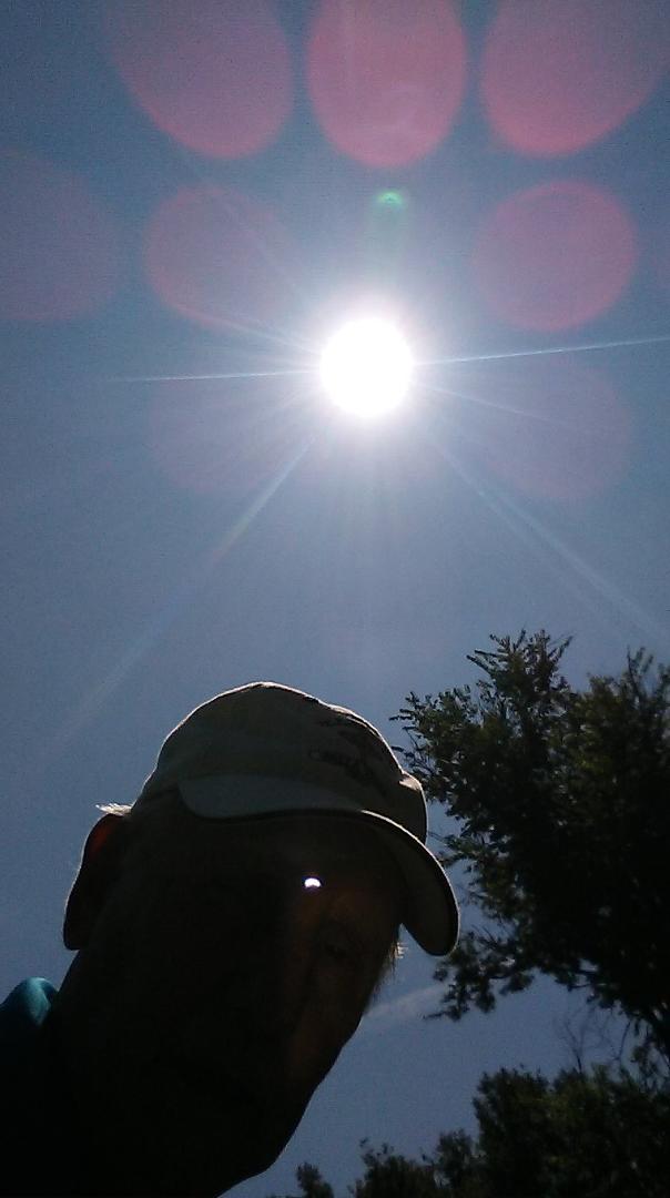 Selfie taken when eclipse was supposedly at peak. Too much light washed out detail of the sun but look at the reflected image on my forehead. I could see eclipse when looking at my phone.