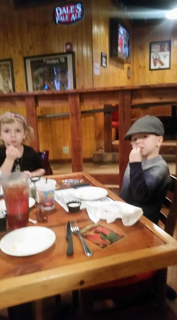 Chloe and Colton eating alligator.