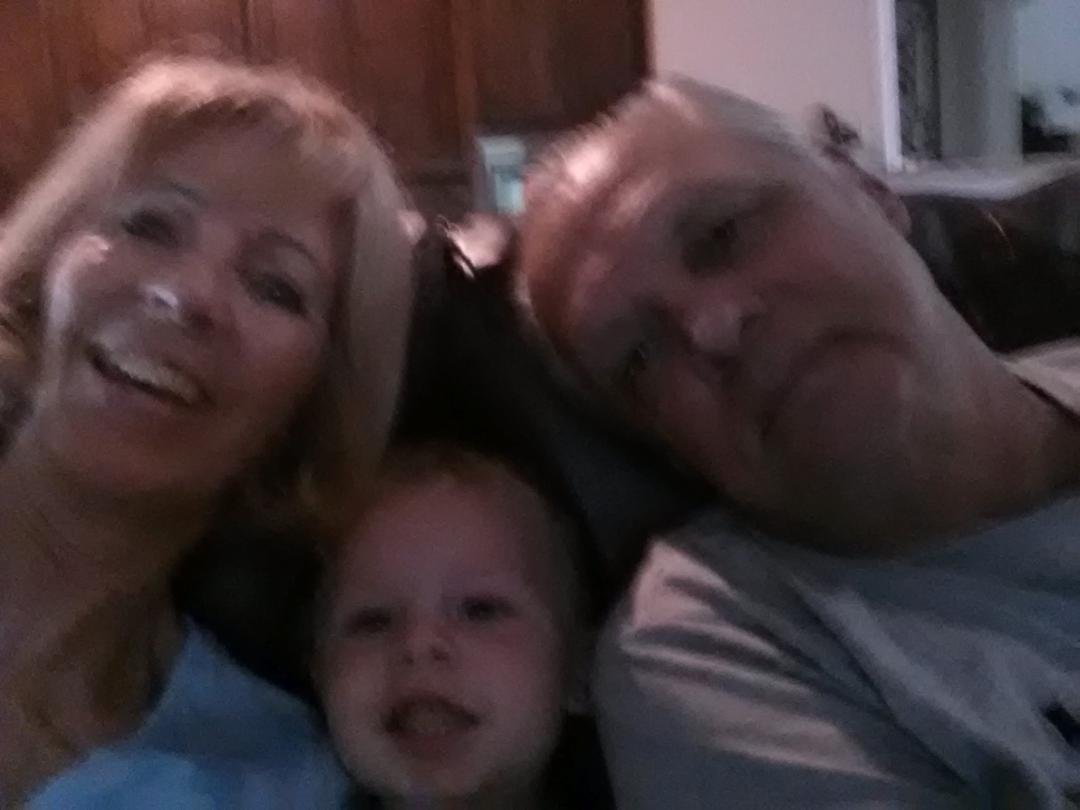 Watching golf with our great grandchild.