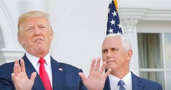 The angle that the photo was taken from makes the flag behind Pence look like a dunce cap. How appropriate as he stands there foolishly while Trump, the blowhard, mouths off mindlessly.