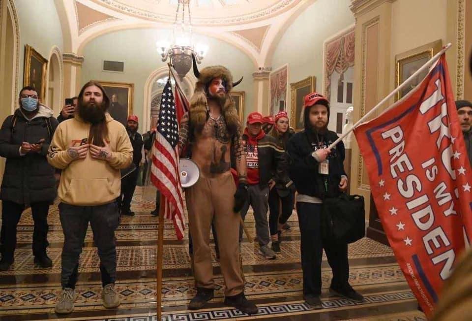 This is Antifa. Look at the tattoo on the guy on your left. They infiltrated the Trump rally!