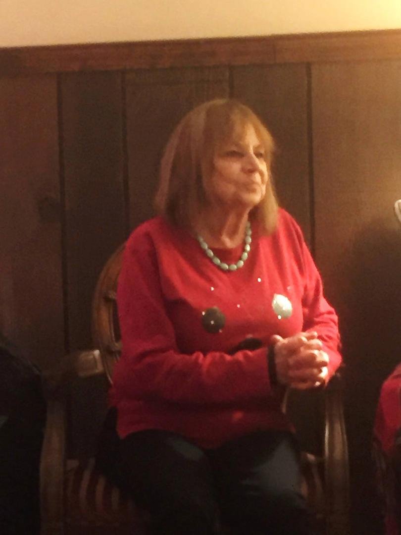 TOM..A GOOD PROFILE OF A HAPPY MIMI WATCHING CHRISTMAS UNFOLDING FOR ANOTHER YEAR....