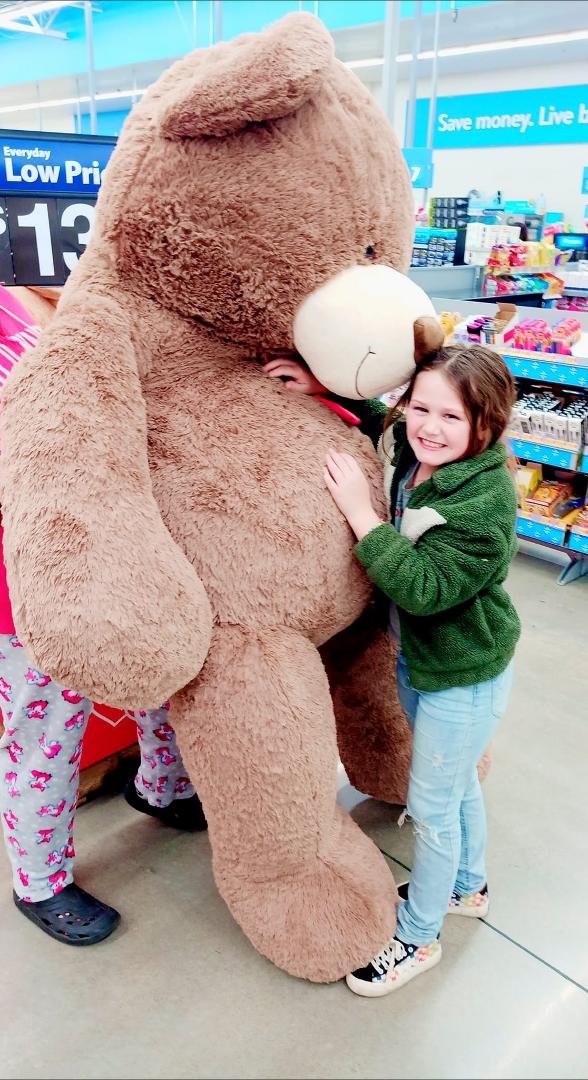 Kyndra and the huge bear they have at Walmart..she loves it