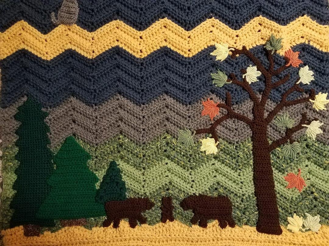 This might be hard to see on FB, but I wanted to post it anyway. This is an afghan that I made for my niece's new baby boy. Bears are special to their family so we have Mama, Papa and baby bear in the mountains of NC.