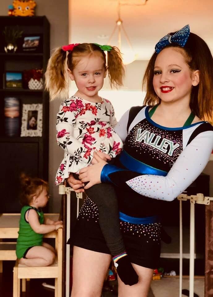 My one year old Charlotte photo bombing Brook and Makayla 😍😂