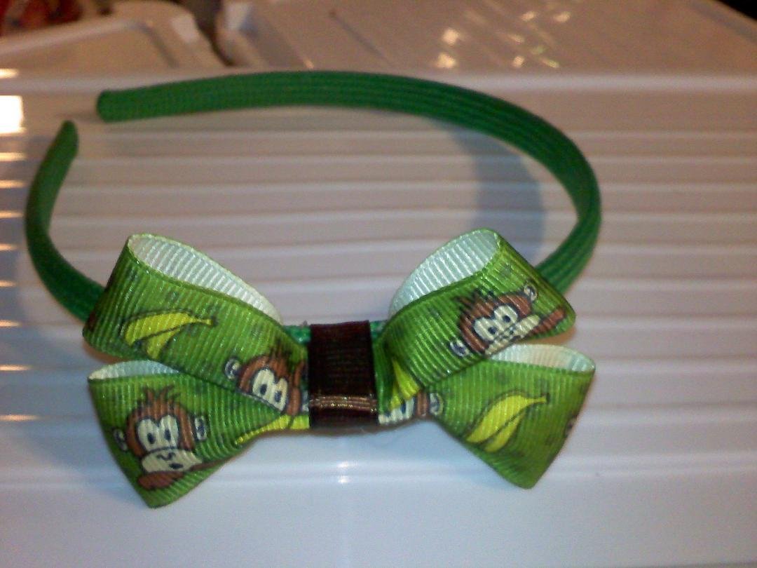 green headband with monkeys reg price 3.00 and 1.50 for shipping but 1st to comment can get for 2.50 and 1.00 for shipping