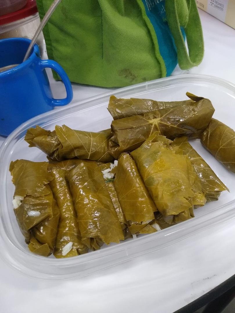 Dolmas for lunch-- rice, raisens, cilantro, honey, pinon-, lemon juice.