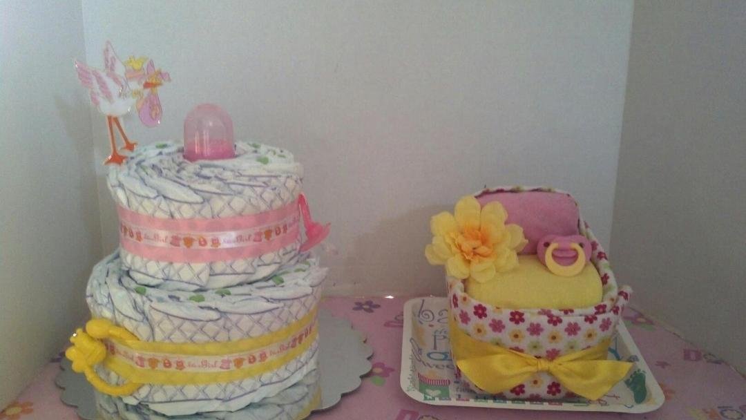 Heres a diaper cake and bassinet i had make i can make thing like this to match in color