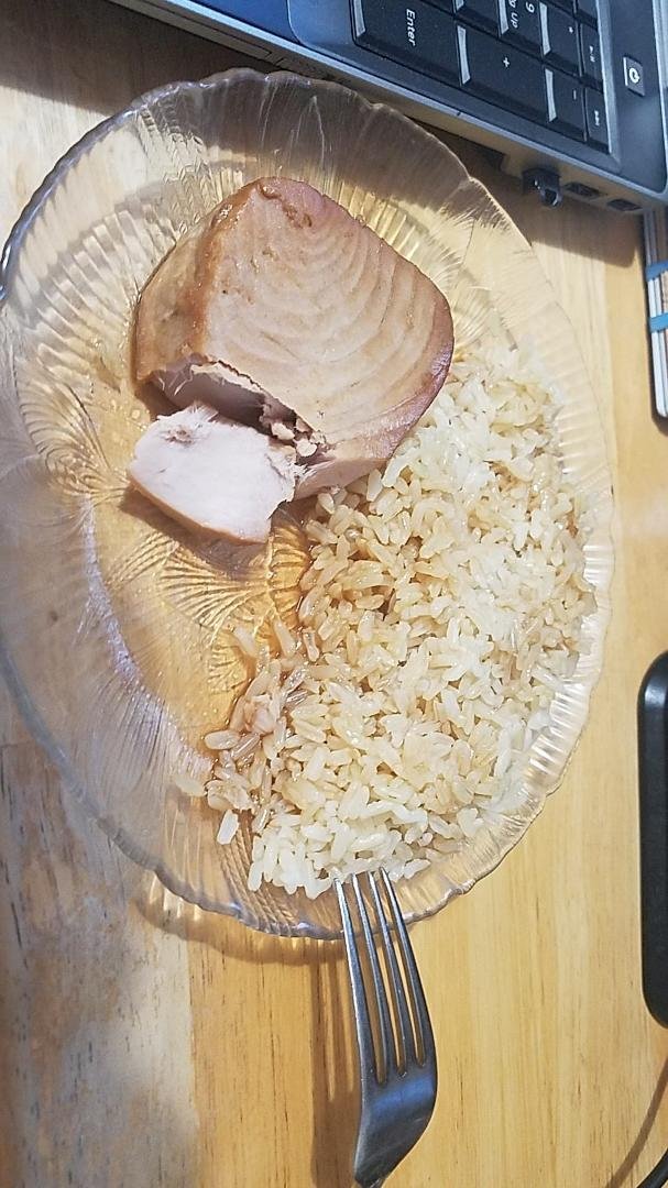 Yellow Fin Tuna Steak, braised in 50/50 Butter/Yoshida's. Drippings drizzled over 1-cup cooked Brown Rice. Sooo good!