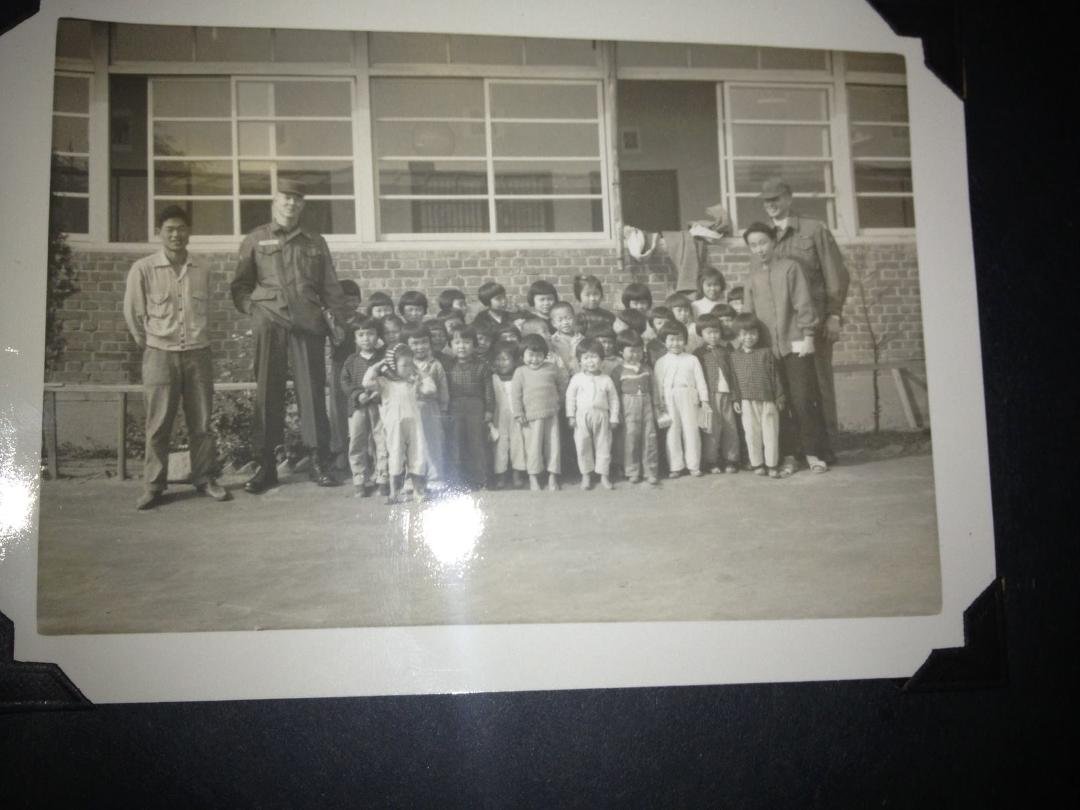 South Korea, Thanksgiving 1964. Orphans are lining up for photos and a ride back to our unit, Headquarters, 65th Medical Group for a Thanksgiving dinner. This orphanage received support from our unit including an occasional