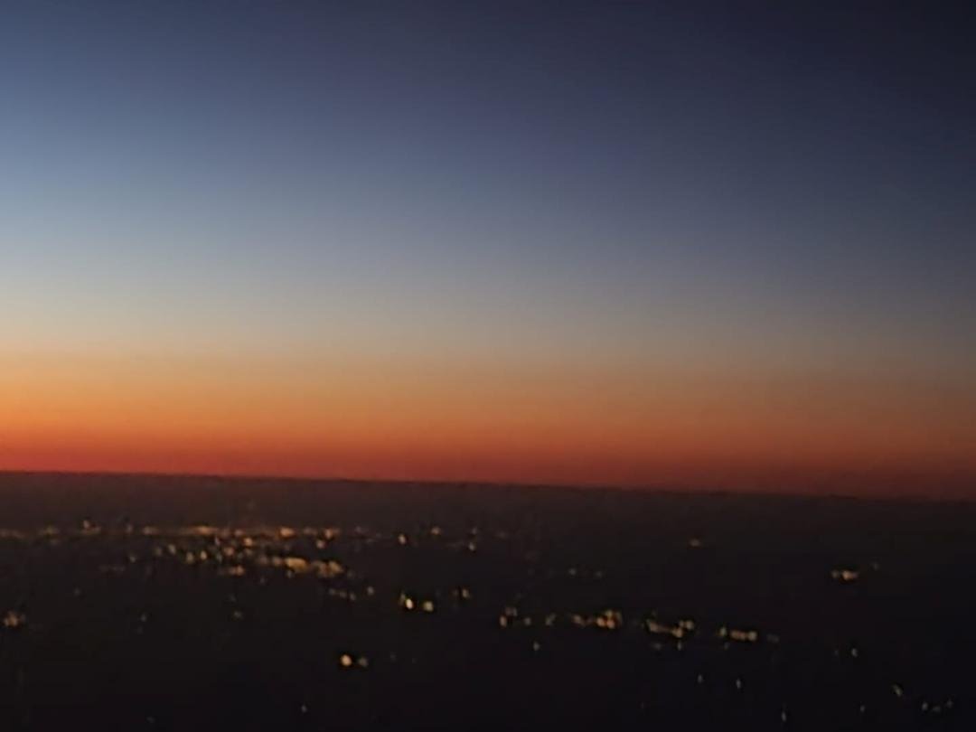 Gorgeous sunset outside plane window