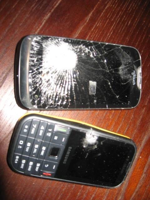 This is the way to fix T-Mobile and their cell phones that don't work. Put two bullet holes through the Gravity and My Touch models and then mail them to Customer Service with a note about their NON- Service in Kansas. Thei