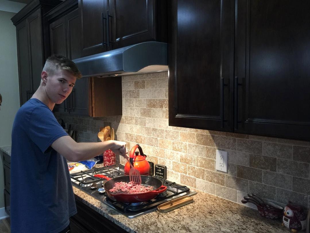 Clay practicing for his job at Taco Bell.. 🙂
Making tacos...