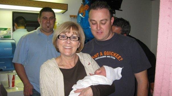 Erik and Paul with their mother Diane, with baby Kyle.